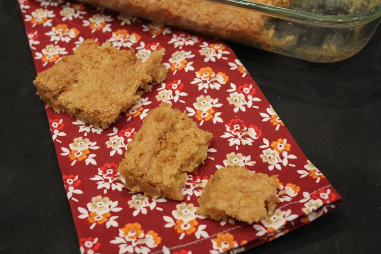 coconut bars on red flowered napkin