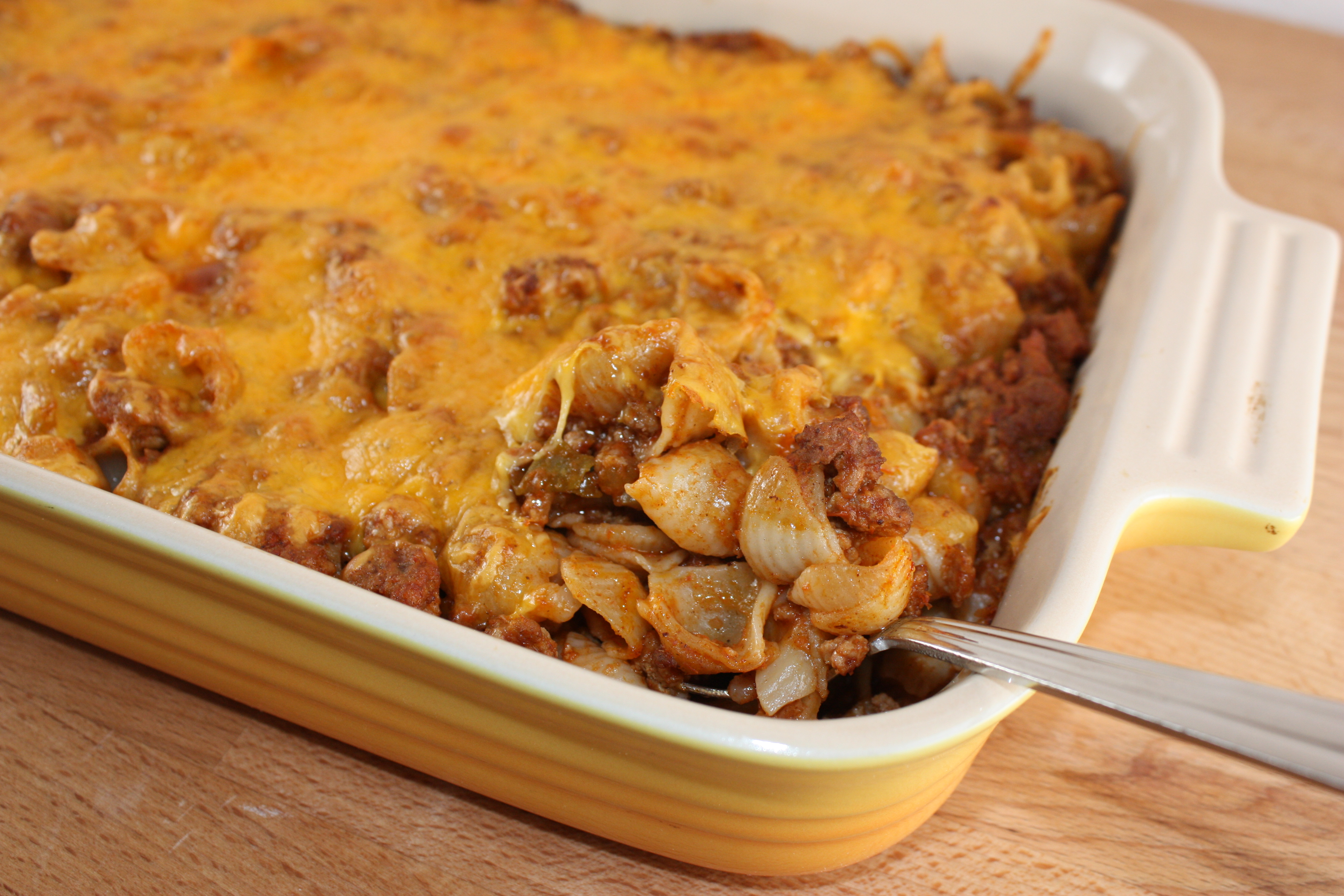 Taco pasta in yellow casserole dish