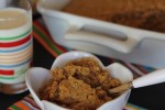 Peanut Butter Baked Oatmeal in white bowl with milk