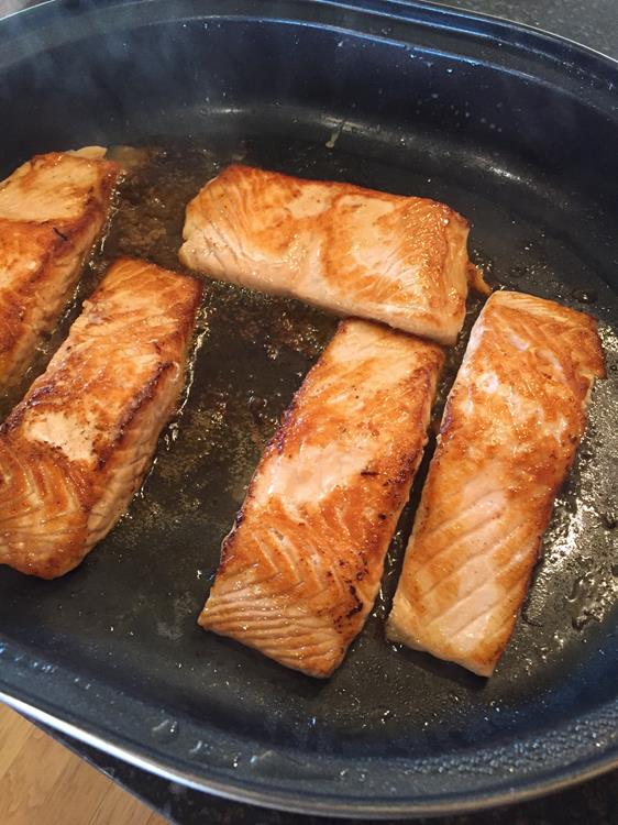 salmon cooking in bacon grease