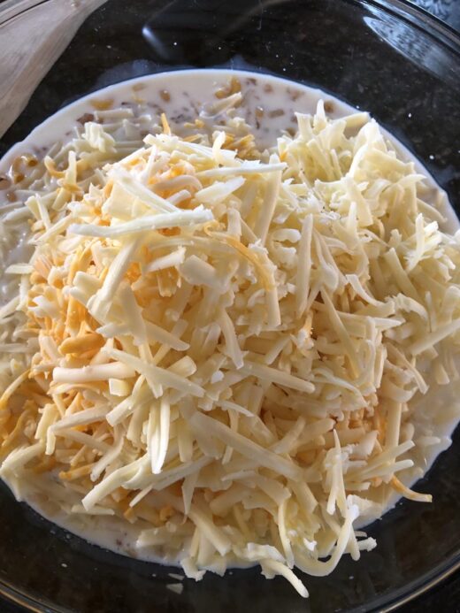 mac and cheese ingredients in a bowl. Cheese, milk, macaroni 