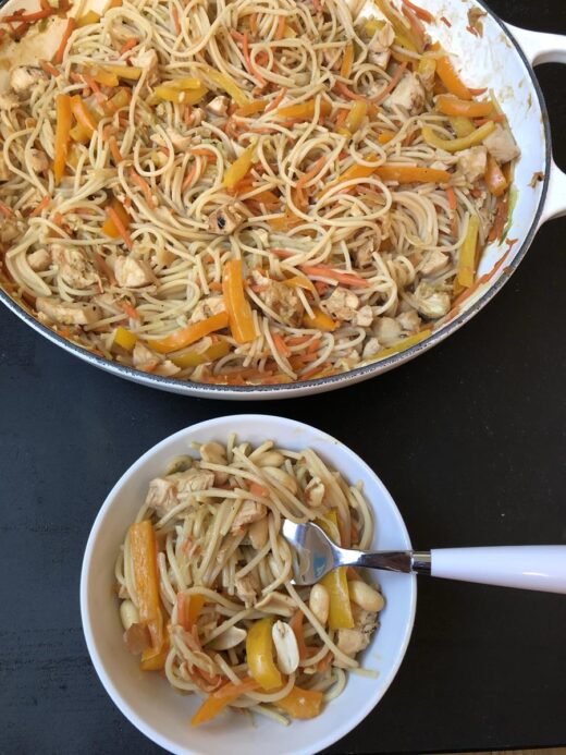 Chicken-Peanut-Noodles in white bowl with fork