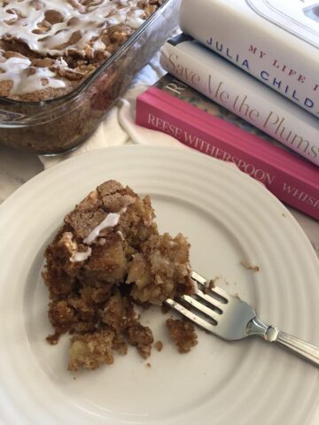 Best Food Memoirs and Biographies book stack and a cake