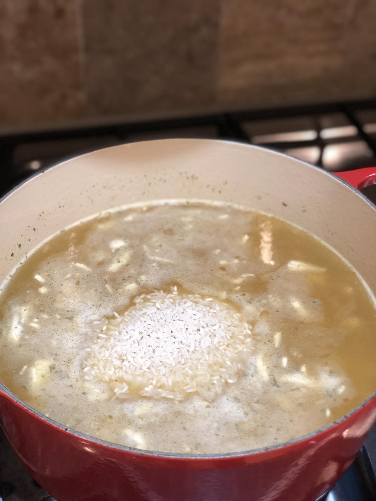 chicken rice soup cooking on stove