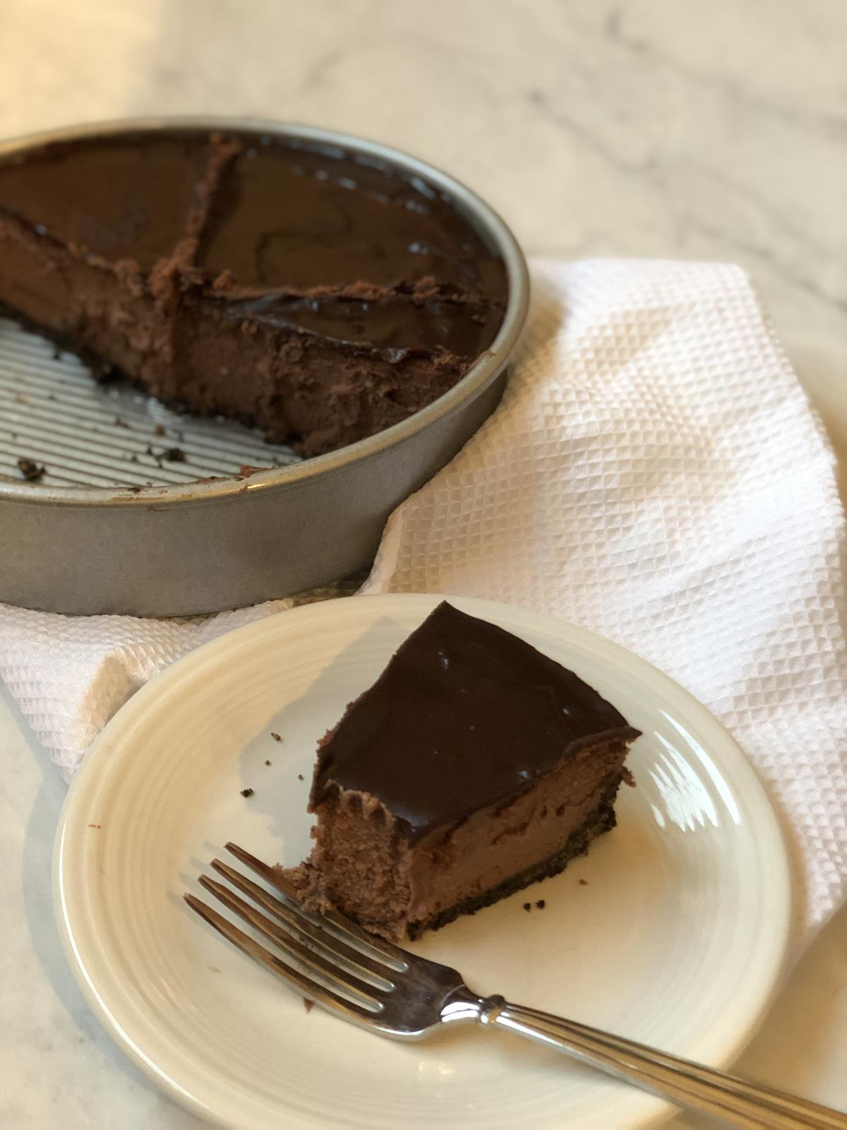 Triple Chocolate Cheesecake on white plate