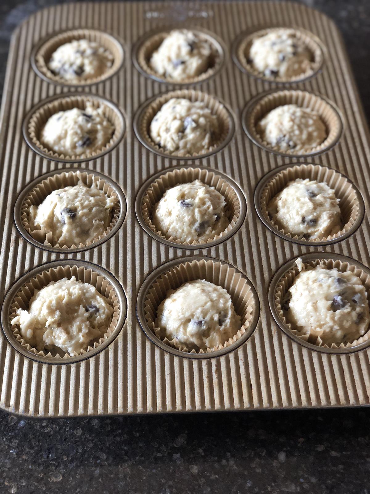 chocolate chip muffin batter in muffin pan