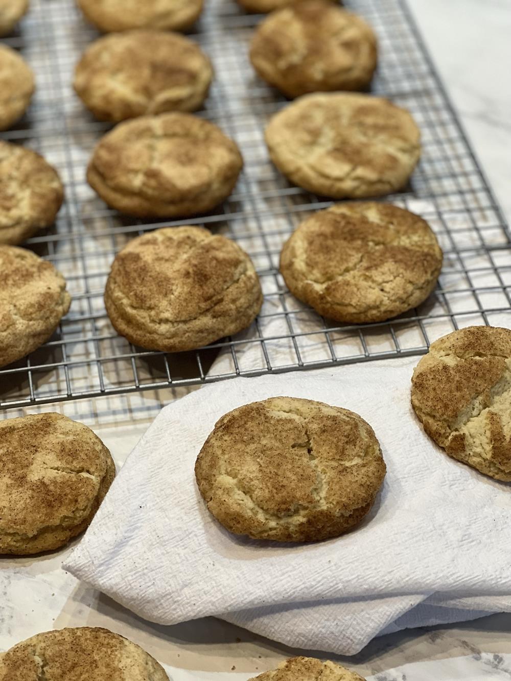 Snickerdoodle cookies on cooling rack