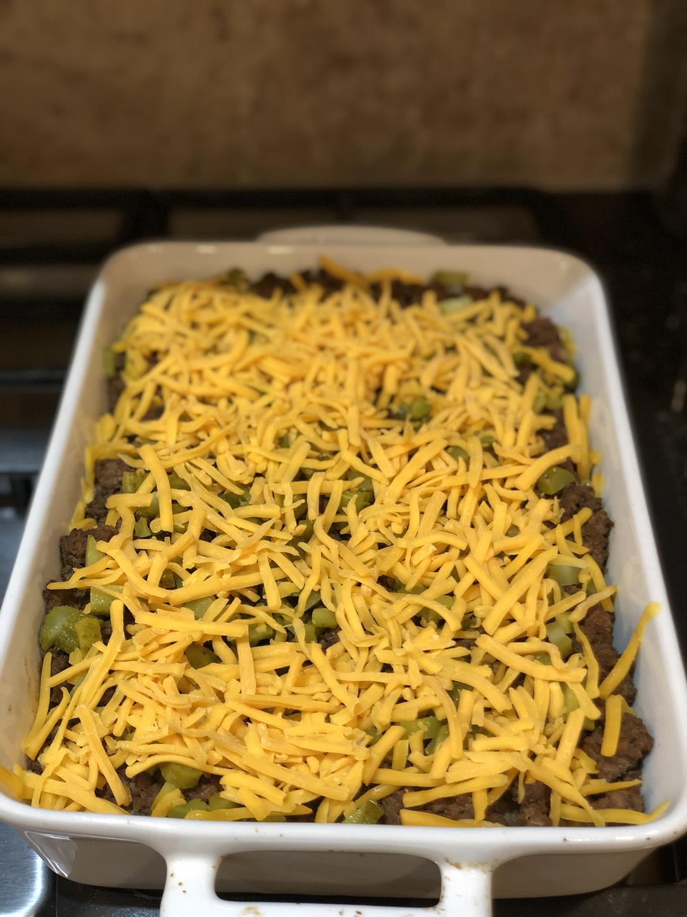 Cheeseburger Casserole Unbaked in white dish
