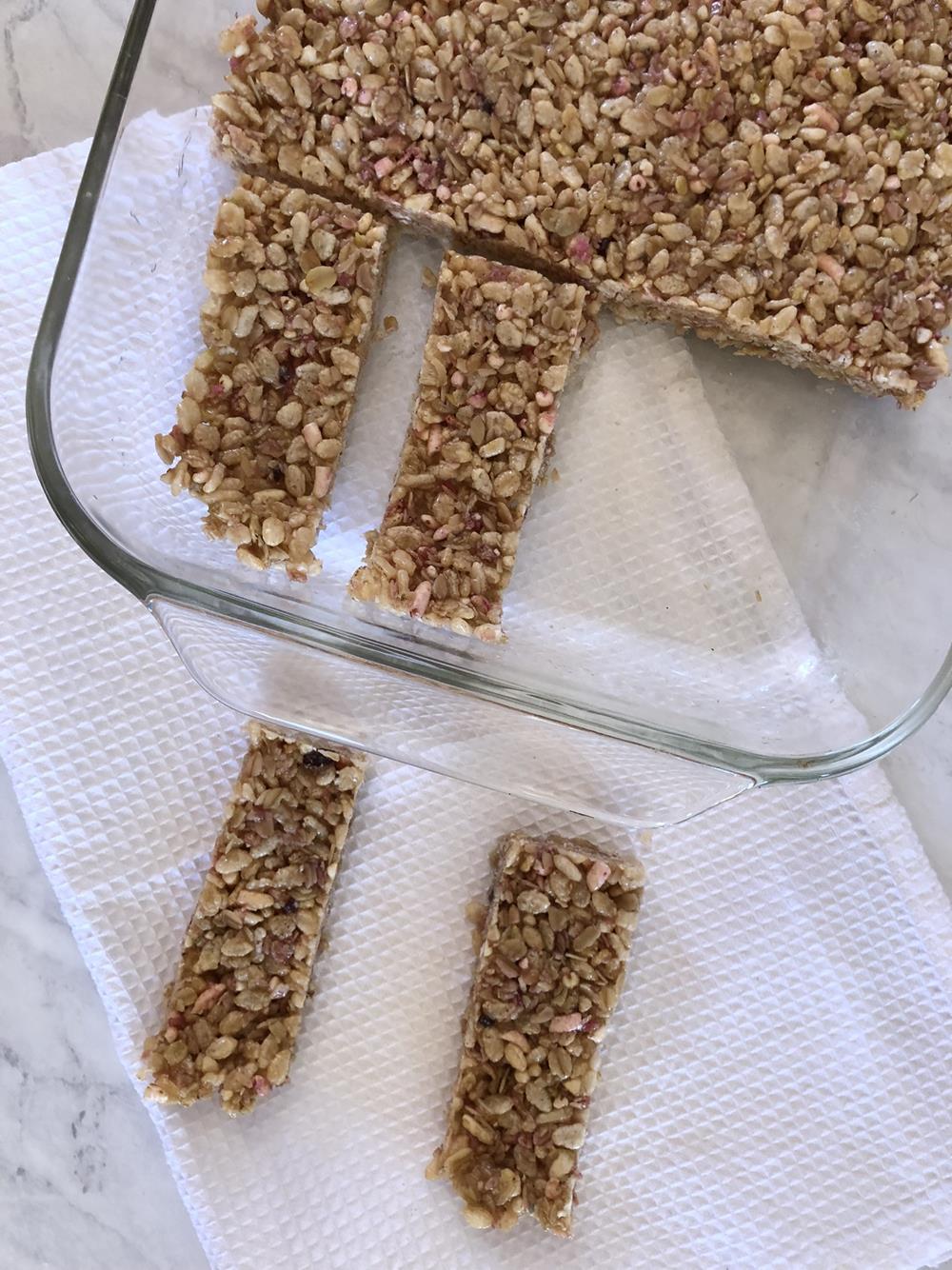 Homemade Granola Bars in glass pan on white cloth