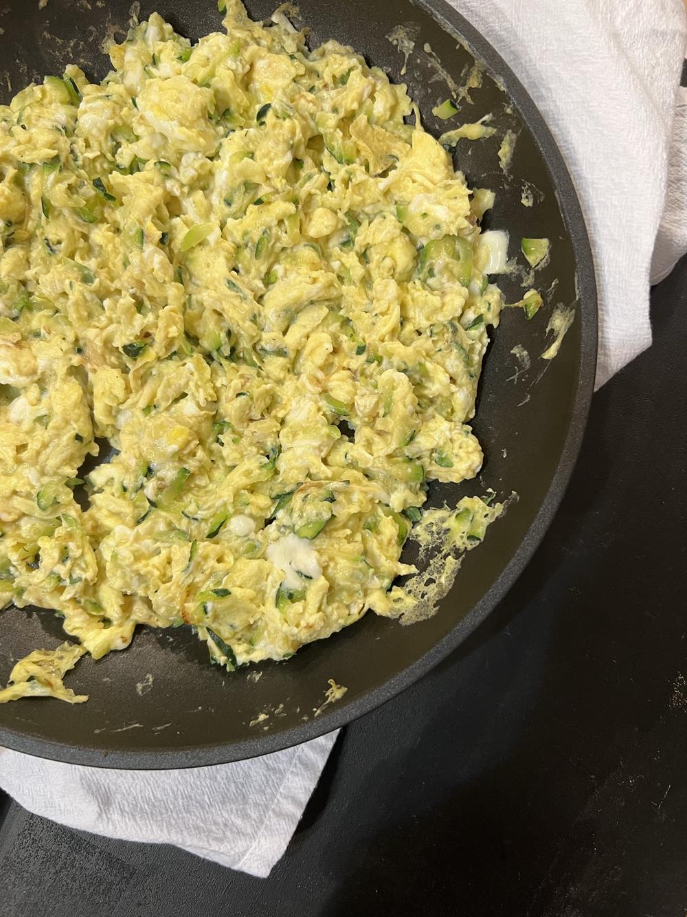 Eggs and Zucchini Scrambled in a pan