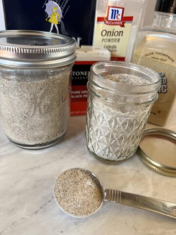 homemade seasoning salt in a jar with ingredients in background