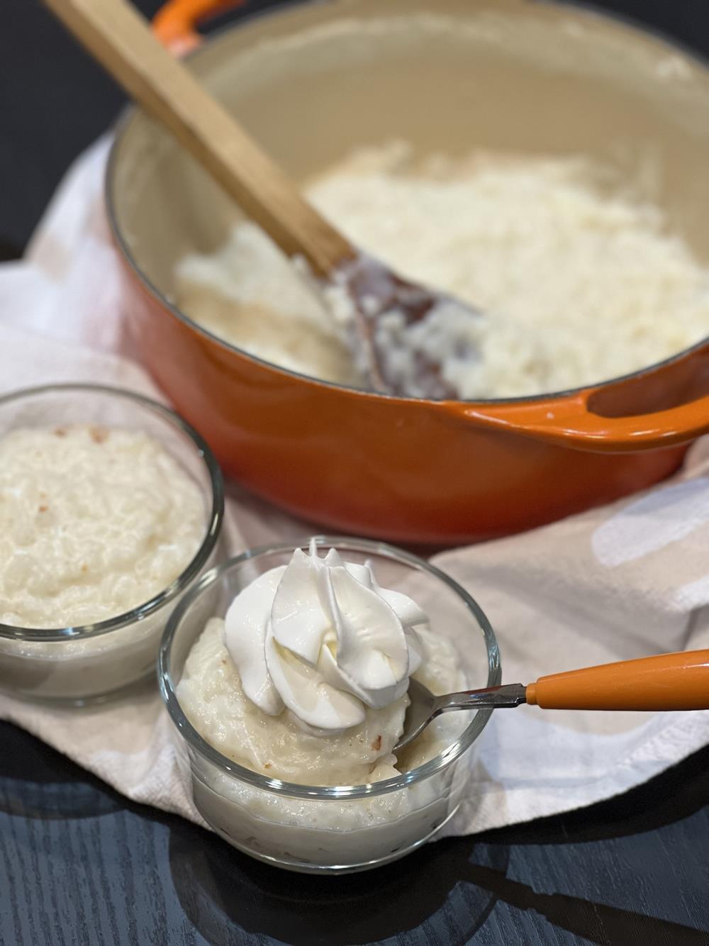 Stove Top Rice Pudding Recipe with Whipped Cream in glass bowl
