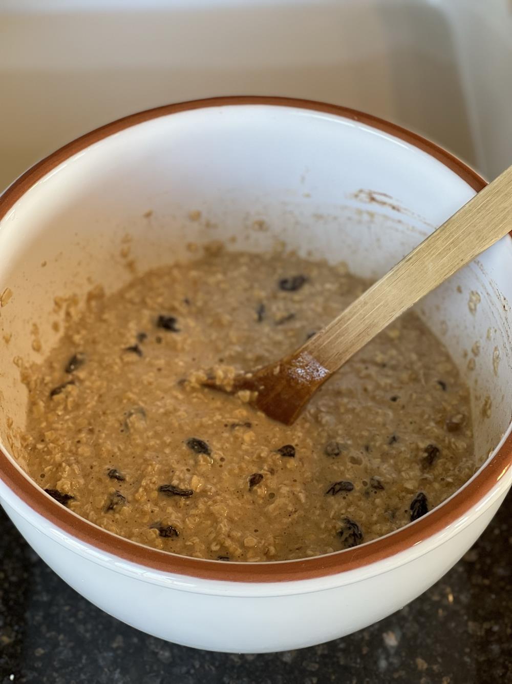 Cinnamon Raisin Baked Oatmeal Mixed in white bowl