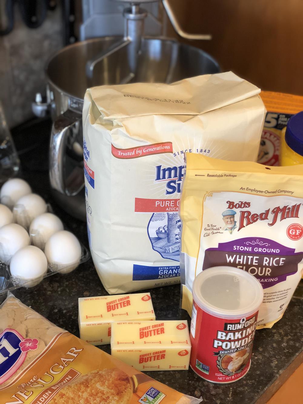 Gluten Free Cookie Ingredients on counter sugar, butter, rice flour, eggs, cornstarch