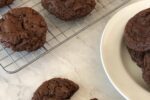 Gluten Free Chocolate Cookies on white plate and cooling rack in background