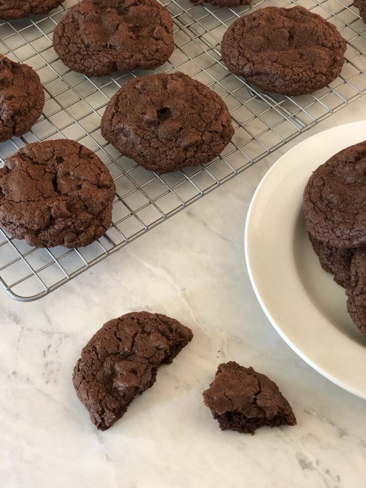 Gluten Free Chocolate Cookies on white plate and cooling rack in background
