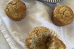 banana muffins on white napkin with muffin pan in backgroundB