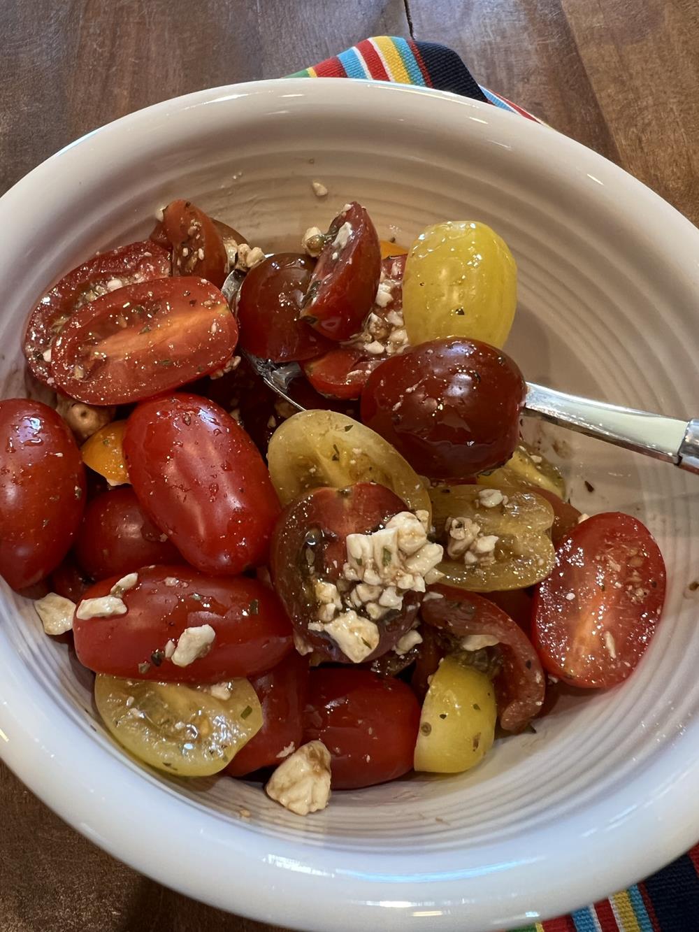 tomato salad in a white bowl