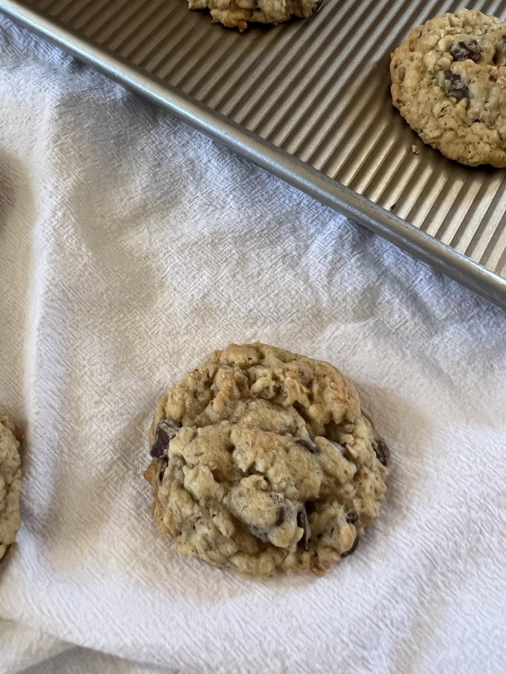 Chocolate Chip Oatmeal Cookies with GF Option on cookie sheet with white napkin