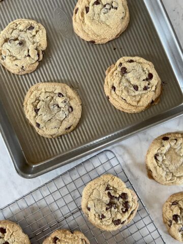 Gluten Free Chocolate Chip Cookies on cooling rack and cookie sheet