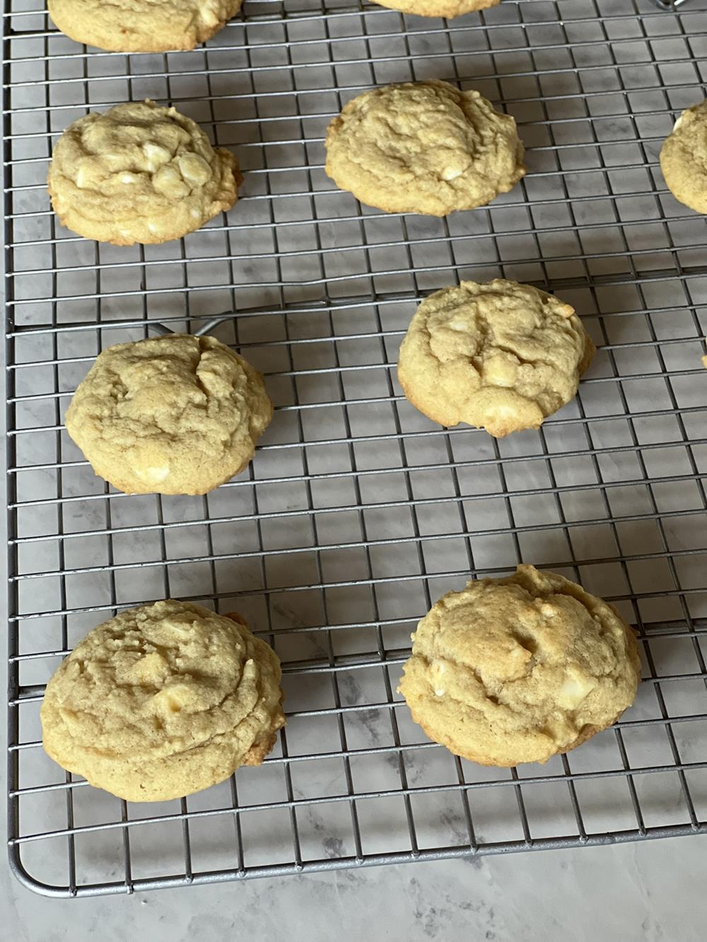 white chocolate lemon cookies on cooling rack
