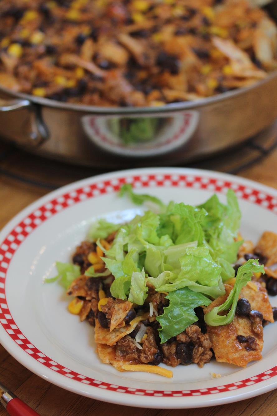 one pot taco meal in pan with some on white and red plate