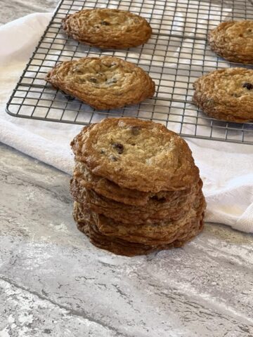 a stack of oatmeal chocolate chip cookies on cooling rack