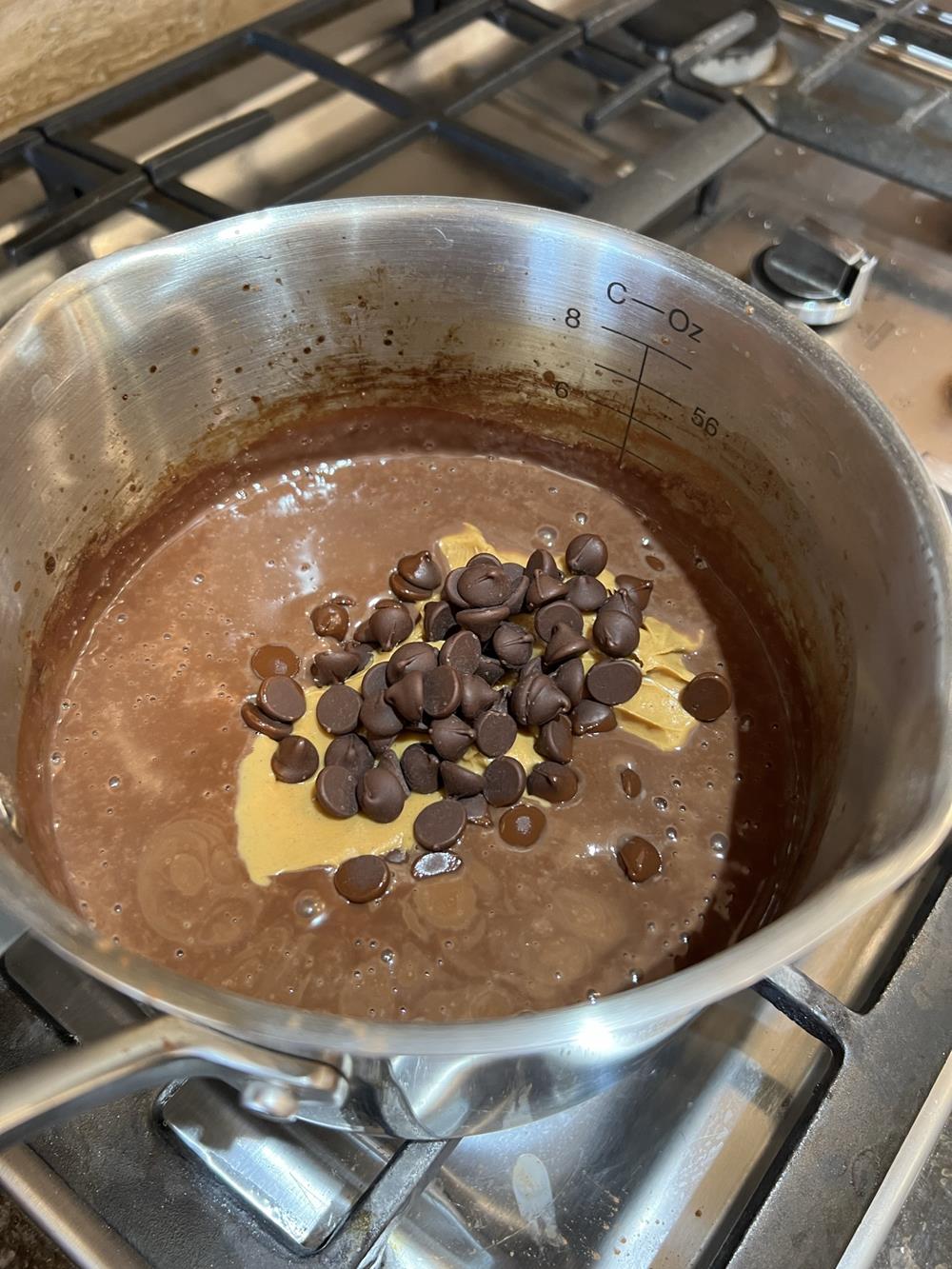 homemade chocolate peanut butter pudding in pan cooking