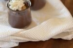 Chocolate pudding with peanut butter with whipped cream on top