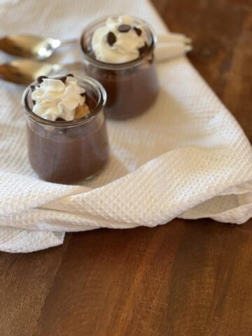 Chocolate pudding with peanut butter with whipped cream on top