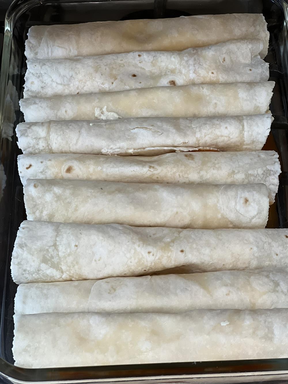 chicken enchiladas in pan without sauce