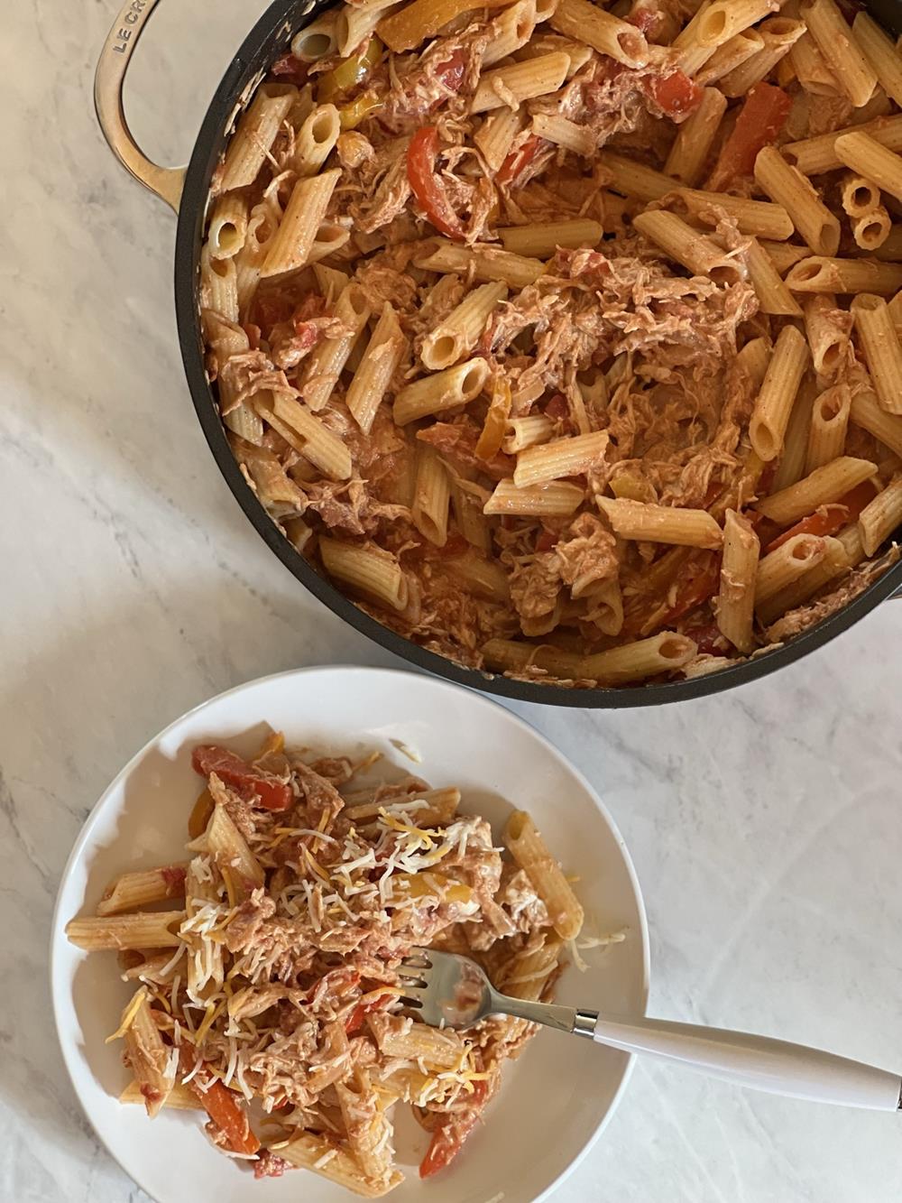 Chicken Fajita Pasta Recipe in pan and white bowl in fork