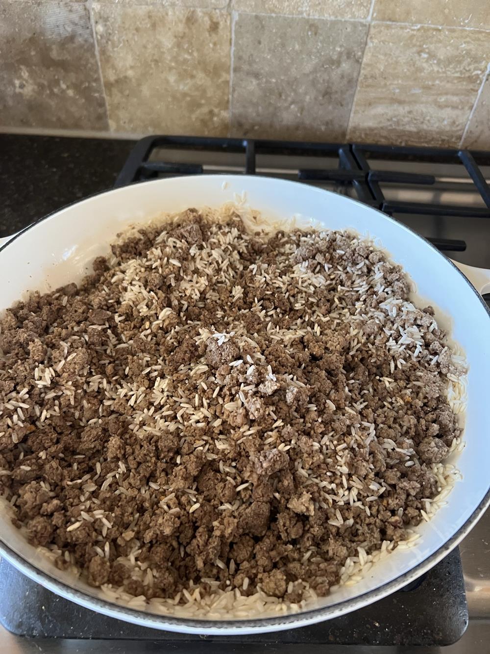 Mexican Rice Cooking in white pan