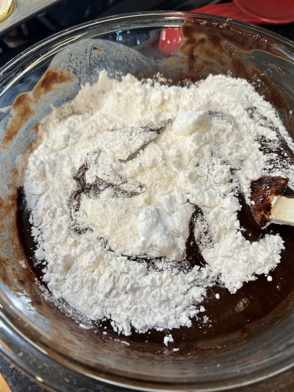 Brownie bites batter in glass bowl