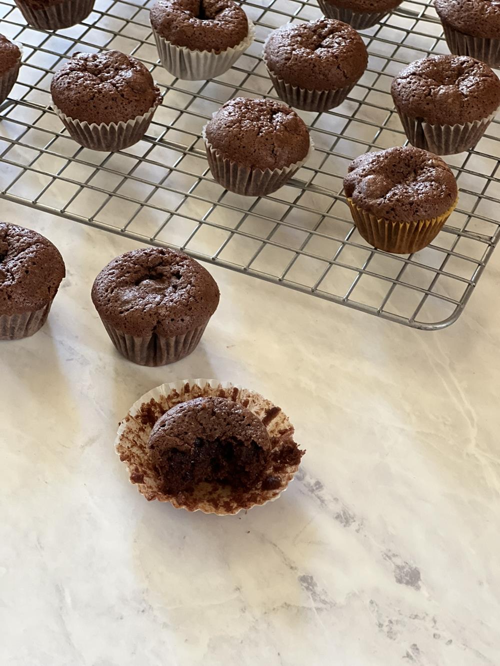 brownie bites on marble background and cooling rack