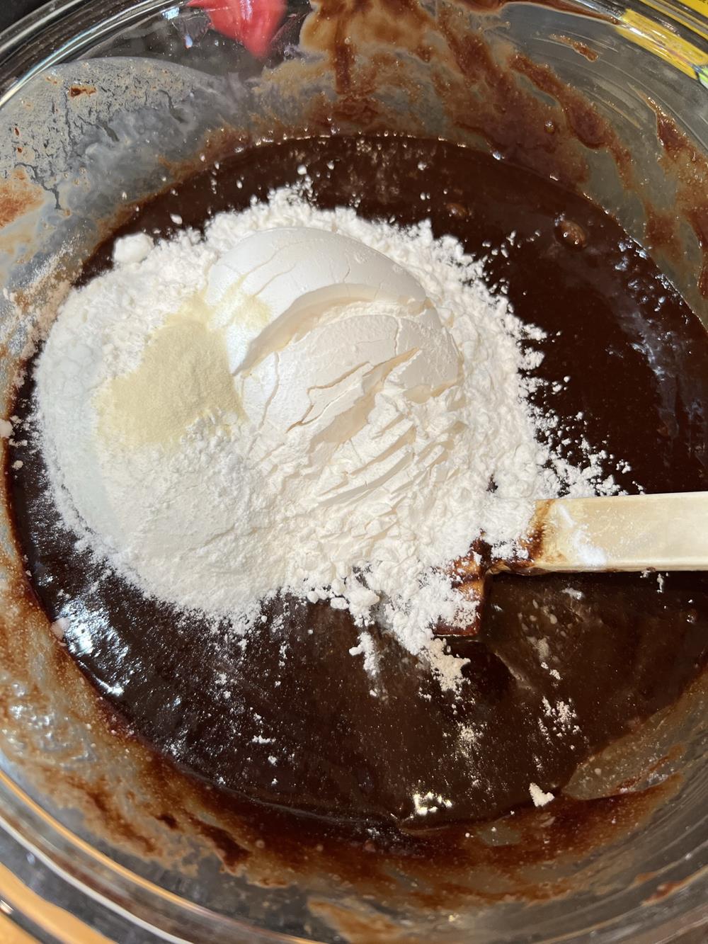 gluten free brownie bites batter in a glass bowl