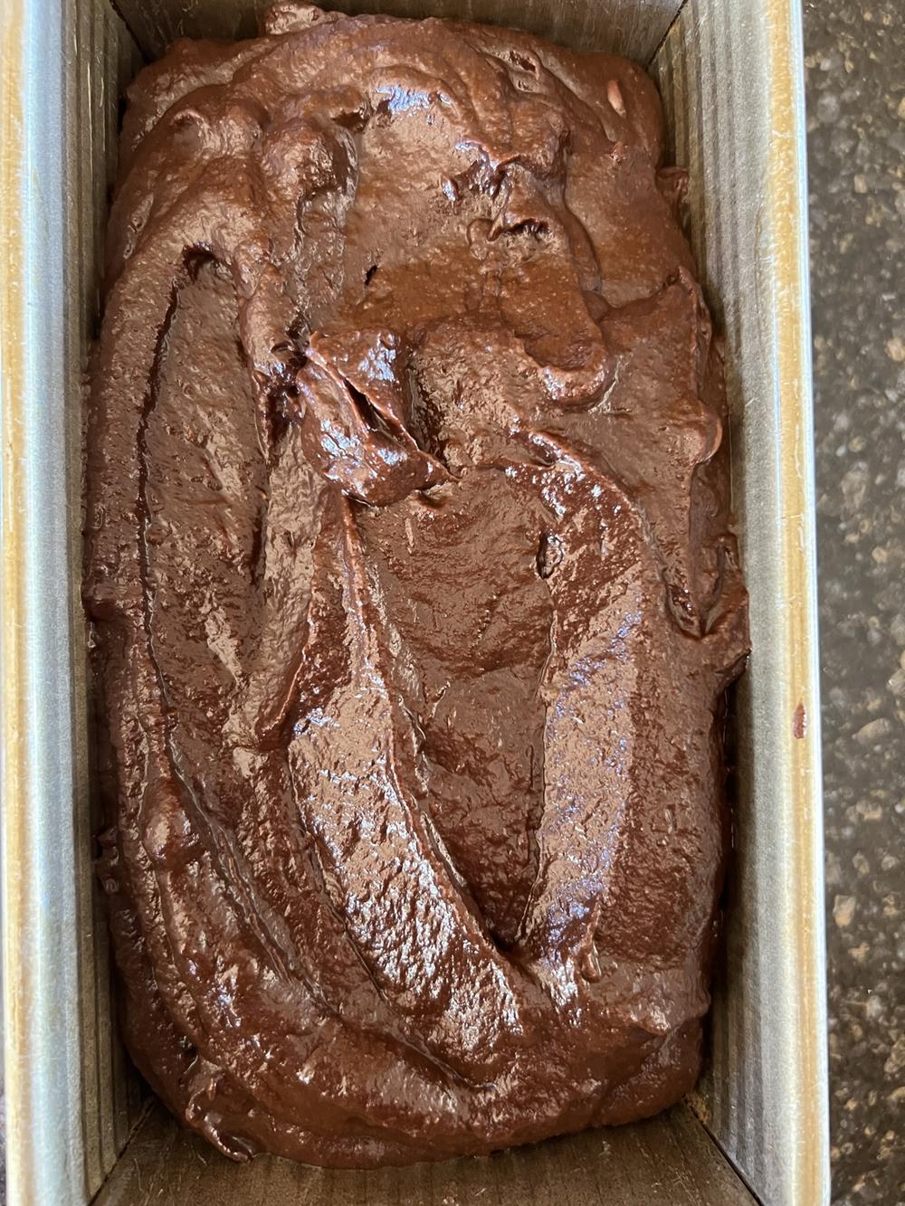 chocolate pumpkin bread batter in loaf pan