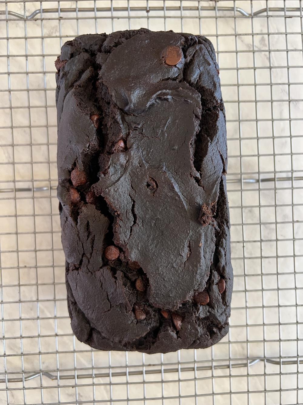 chocolate pumpkin bread loaf on cooling rack