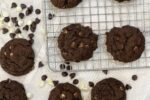 gluten free inside out cookies on wire cooling rack with chocolate chips scattered around