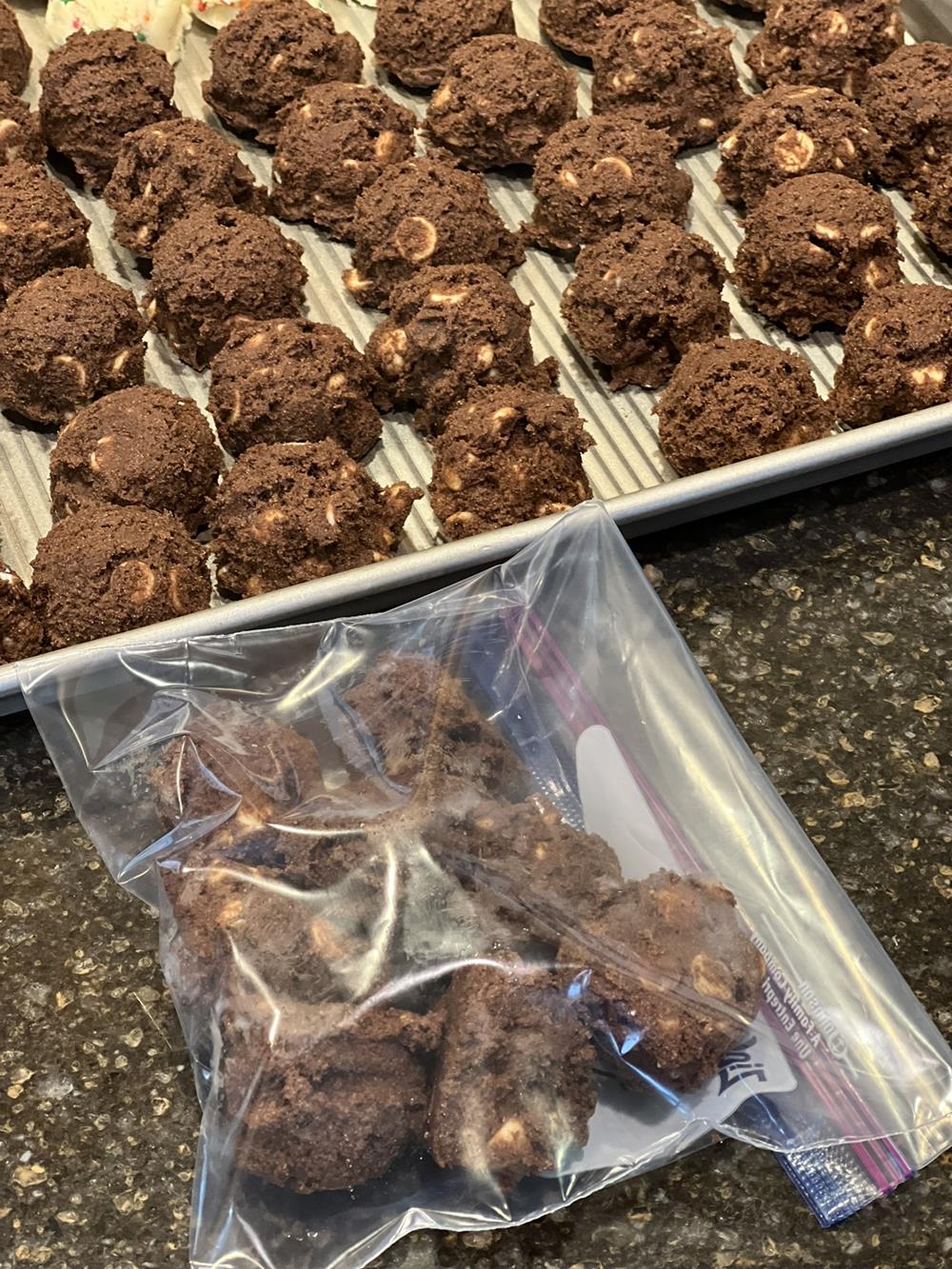 chocolate chip cookie dough in ziploc bag with cookie sheet in background