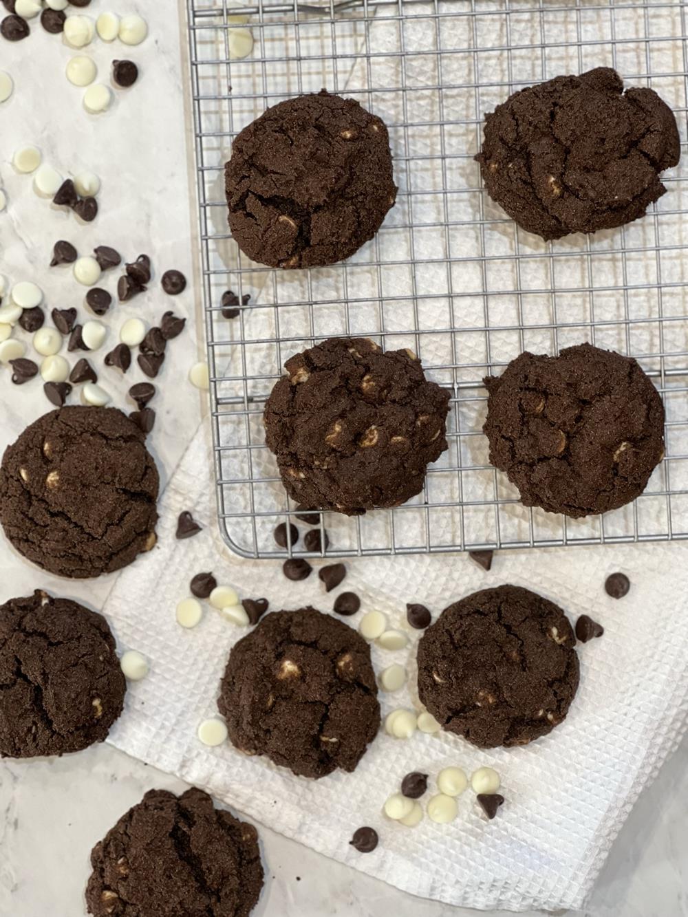 gluten free inside out cookies on wire cooling rack with chocolate chips scattered around