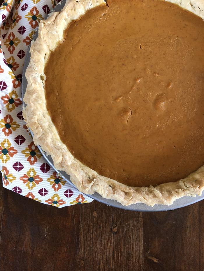 Pumpkin pie in a metal pie pan. 