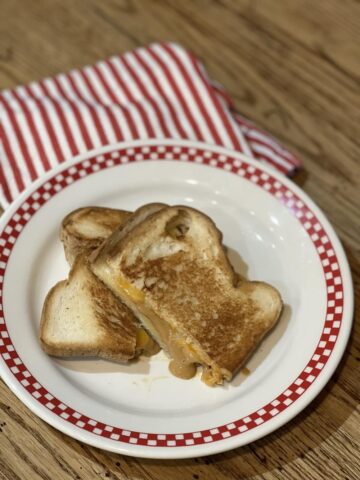 Grilled Peanut Butter and Cheese Sandwich on plate with red and white napkin