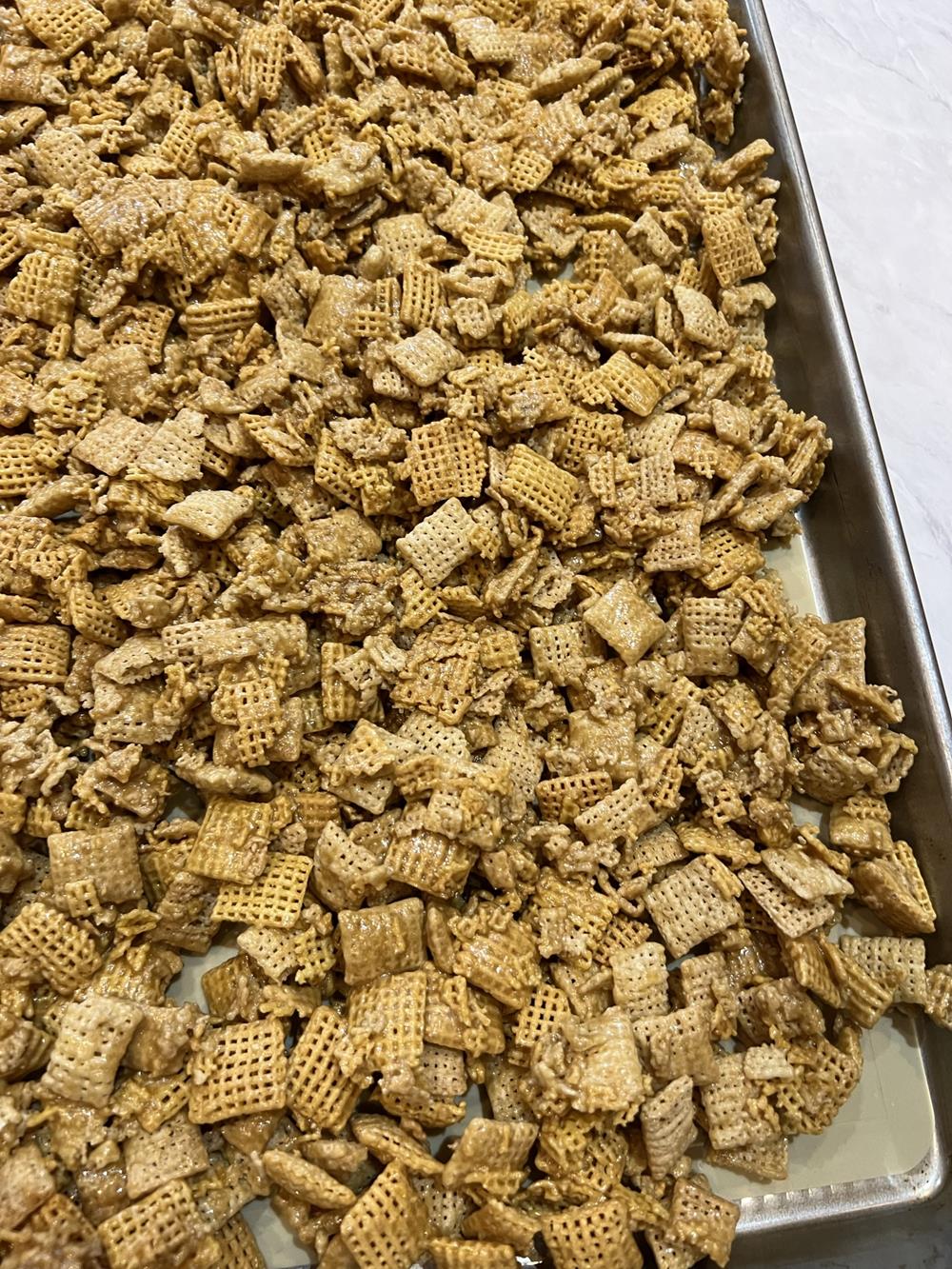 caramel chex mix on cookie sheet