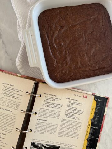 cookbook and a pan of brownies
