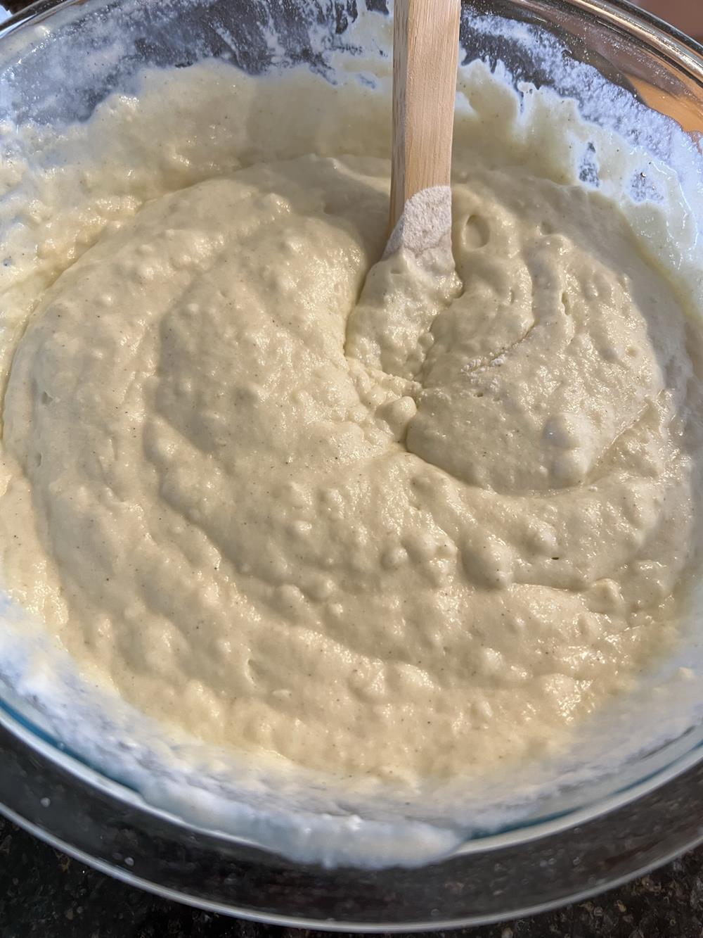 waffle batter in a glass mixing bowl