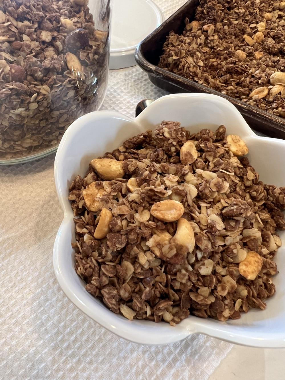 homemade chocolate peanut butter granola in white bowl 