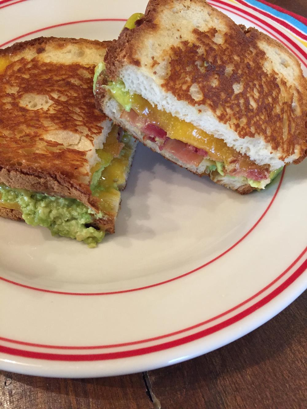 Bacon Avocado Grilled Cheese Sandwich on white and red plate