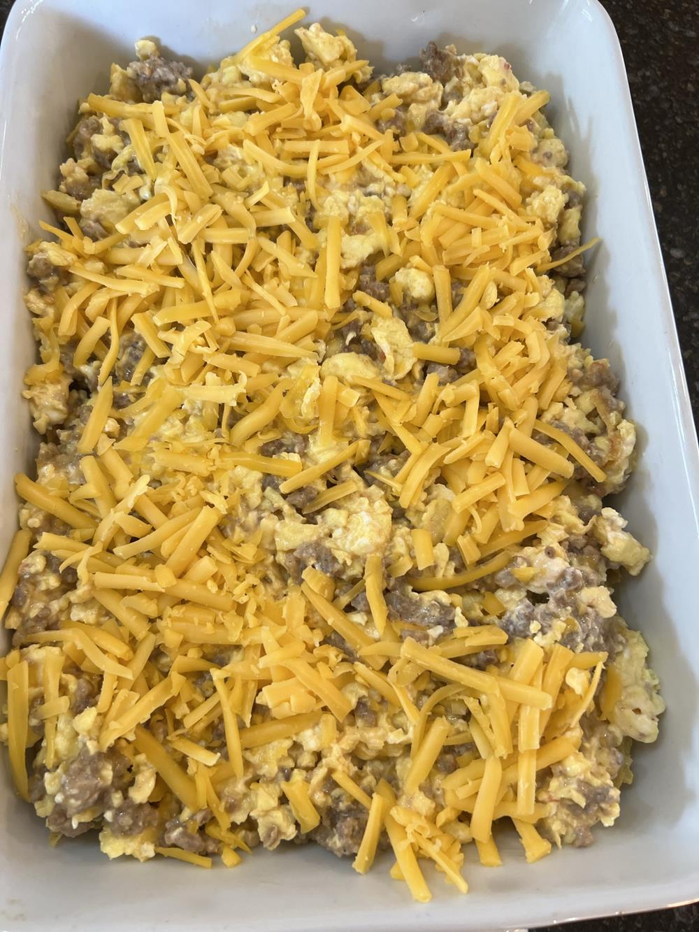 unbaked Mexican breakfast casserole in white baking dish