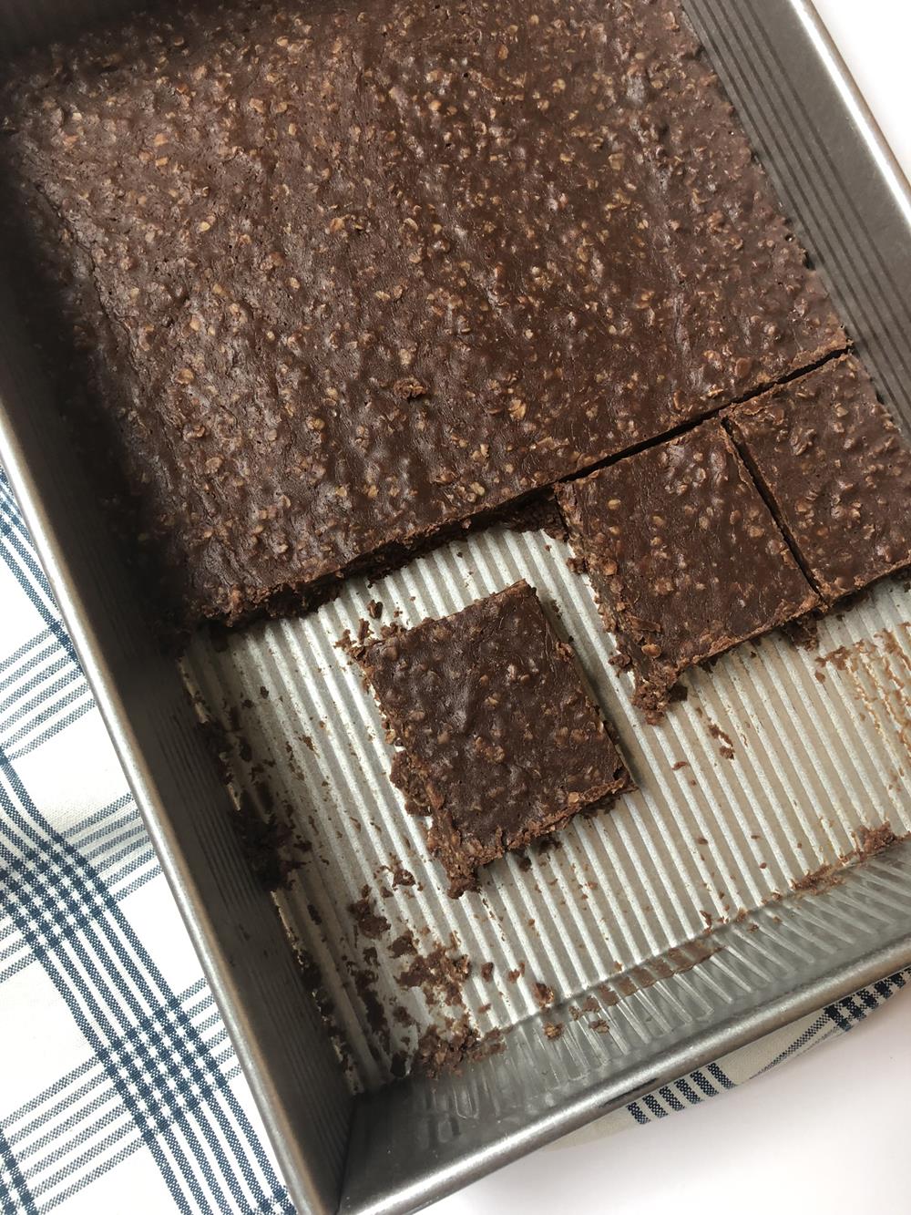 No Bake Cookie Bar in pan with white and blue napkin in the background